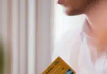 person holding credit card